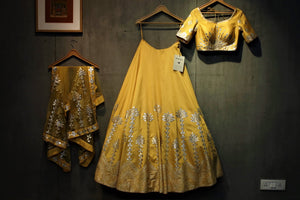 Buy yellow gota patti lehenga with choli online in USA. It comes with a matching dupatta. Find more such exquisite designer lehengas at Pure Elegance online store. You can also give us a visit at our exclusive Indian fashion store in USA and shop from a range of beautiful Indian lehengas, wedding dresses, Anarkalis and much more.-set of 3