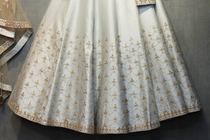 Buy pastel grey gota patti chanderi silk lehenga choli online in USA. It comes with a matching dupatta. Find more such exquisite designer lehengas at Pure Elegance online store. You can visit at our exclusive Indian clothing store in USA and shop from a range of beautiful Indian lehengas, wedding dresses, Anarkalis and much more.-lehenga