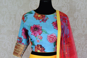 Buy yellow pink striped silk lehenga with blue floral print blouse online in USA and dupatta. Find a range of stunning designer lehengas in USA at Pure Elegance Indian clothing store. Elevate your traditional style with a range of designer saris, Indian clothing, and much more also available at our online store.-blouse front