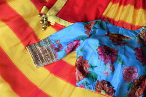 Buy yellow pink striped silk lehenga with blue floral print blouse online in USA and dupatta. Find a range of stunning designer lehengas in USA at Pure Elegance Indian clothing store. Elevate your traditional style with a range of designer saris, Indian clothing, and much more also available at our online store.-details