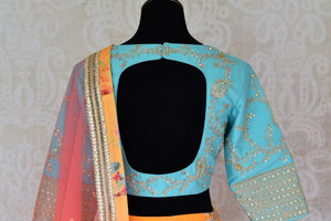 Buy yellow floral silk lehenga with blue embroidered blouse online in USA and dupatta. Find a range of stunning designer lehengas in USA at Pure Elegance Indian clothing store. Elevate your traditional style with a range of designer saris, Indian clothing, and much more also available at our online store.-blouse back