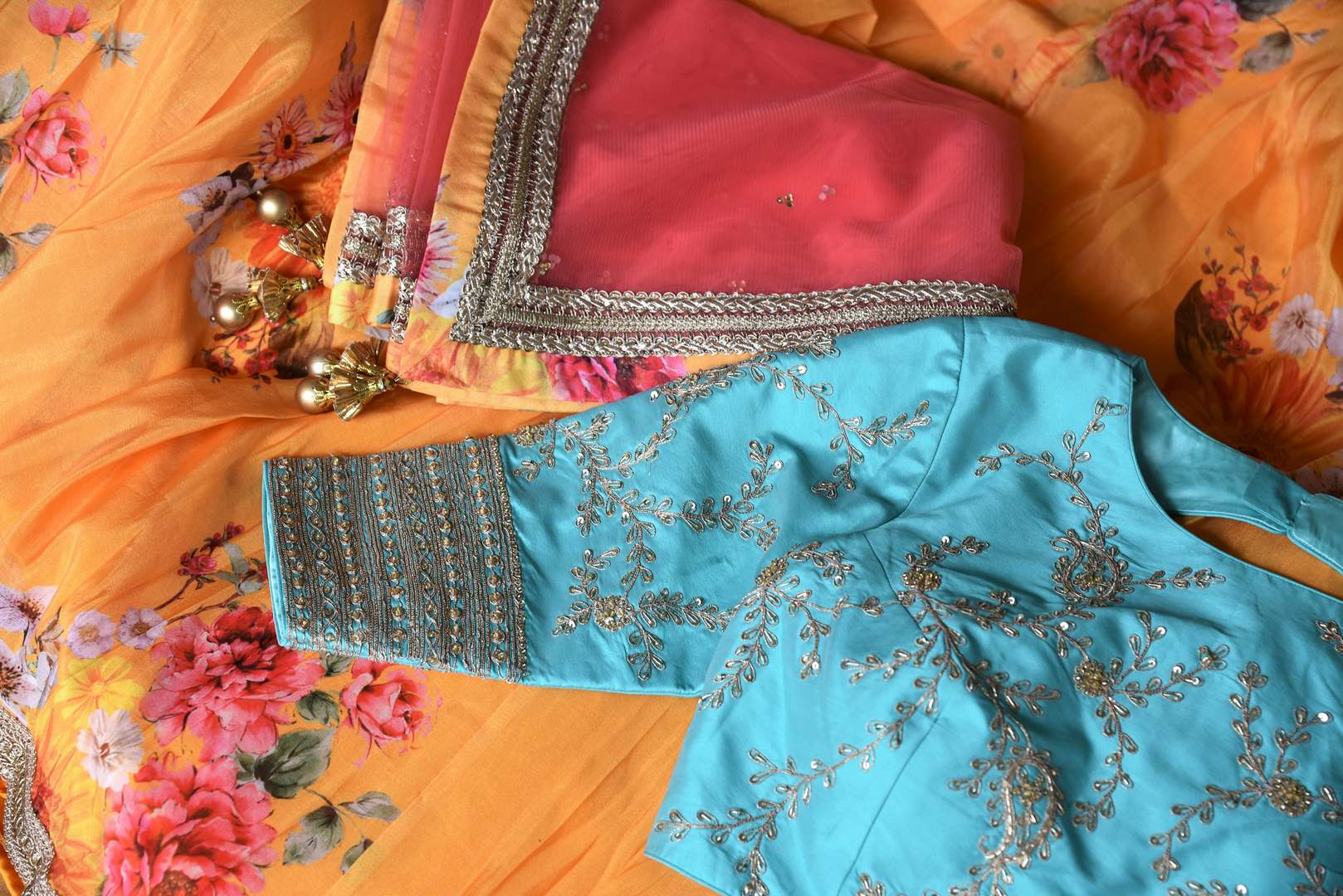 Buy yellow floral silk lehenga with blue embroidered blouse online in USA and dupatta. Find a range of stunning designer lehengas in USA at Pure Elegance Indian clothing store. Elevate your traditional style with a range of designer saris, Indian clothing, and much more also available at our online store.-details