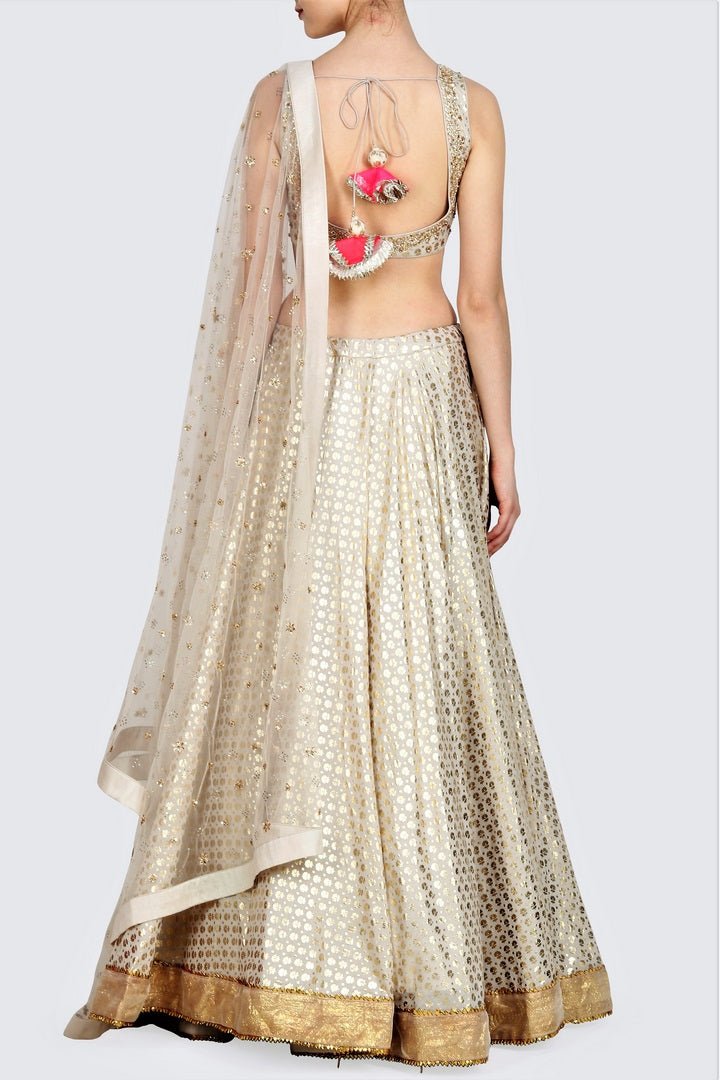 Shop off-white foil print lehenga online in USA with mukesh net dupatta. For more such gorgeous designer lehengas, shop at Pure Elegance Indian fashion store in USA. A beautiful range of traditional sarees and clothing is available for Indian women living in USA. You can also shop at our online store.-back