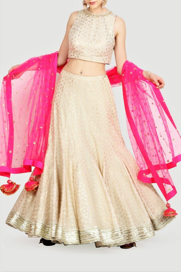 Buy off-white foil print lehenga online in USA with pink embroidered net dupatta. For more such gorgeous designer lehengas, shop at Pure Elegance Indian fashion store in USA. A beautiful range of traditional sarees and clothing is available for Indian women living in USA. You can also shop at our online store.-full view