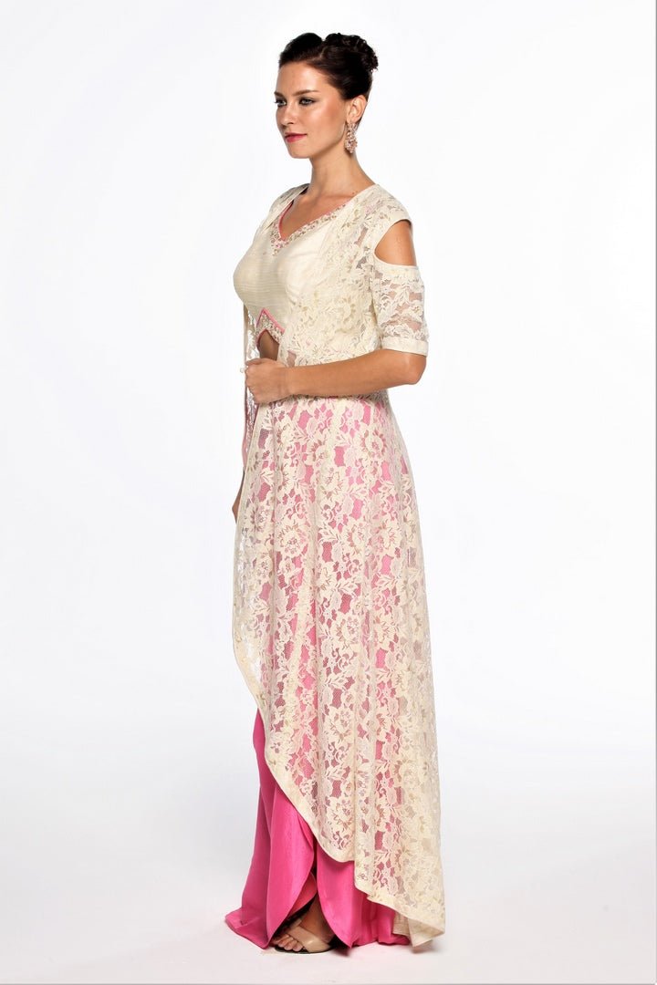 Buy designer pink draped skirt with white lace jacket online in USA at Pure Elegance online store. Get a gorgeous ethnic look with a range of exquisite Indian designer dresses from our clothing store in USA. We also bring the best Indian dresses for brides in USA under one roof. Shop now.-left