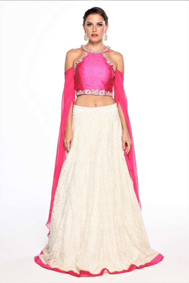 Buy pink embroidered top with metallic lace lehenga online in USA at Pure Elegance online store. Get a gorgeous ethnic look with a range of exquisite Indian designer dresses from our clothing store in USA. We also bring the best Indian dresses for brides in USA under one roof. Shop now.-full view