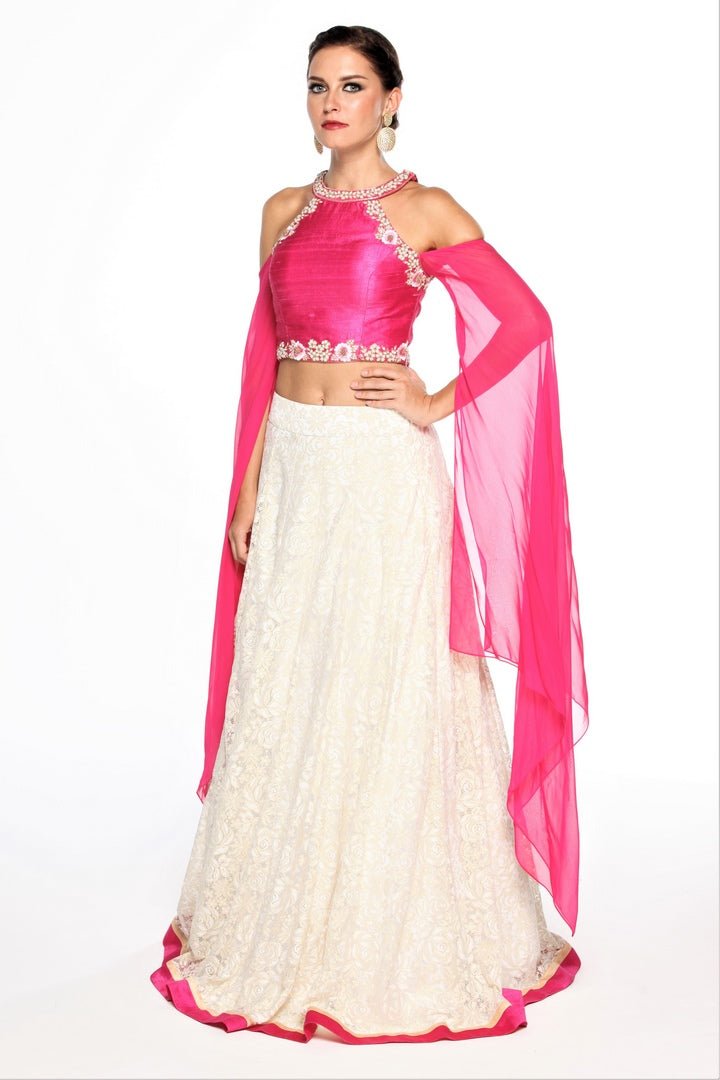 Buy pink embroidered top with metallic lace lehenga online in USA at Pure Elegance online store. Get a gorgeous ethnic look with a range of exquisite Indian designer dresses from our clothing store in USA. We also bring the best Indian dresses for brides in USA under one roof. Shop now.-left
