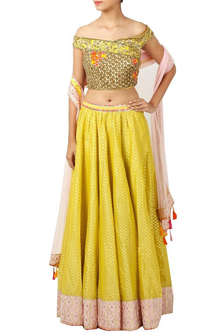 Buy yellow color embroidered lehenga online in USA with off shoulder blouse. Find a range of Indian wedding dresses for brides at Pure Elegance clothing store in USA. Keep your ethnic look perfect with a range of traditional Indian clothing, designer silk saris, wedding saris and much more also available at our online store.-full view