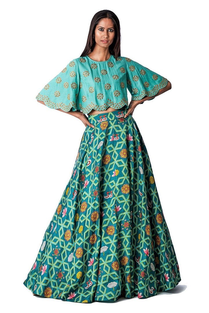 Shop designer dark teal jaal lehenga with danka top online in USA. Find a range of stunning designer dresses by Swati Vijayvargie in USA at Pure Elegance Indian clothing store. Elevate your traditional style with a range of designer silk sarees, Indian clothing, and much more also available at our online store.-full view