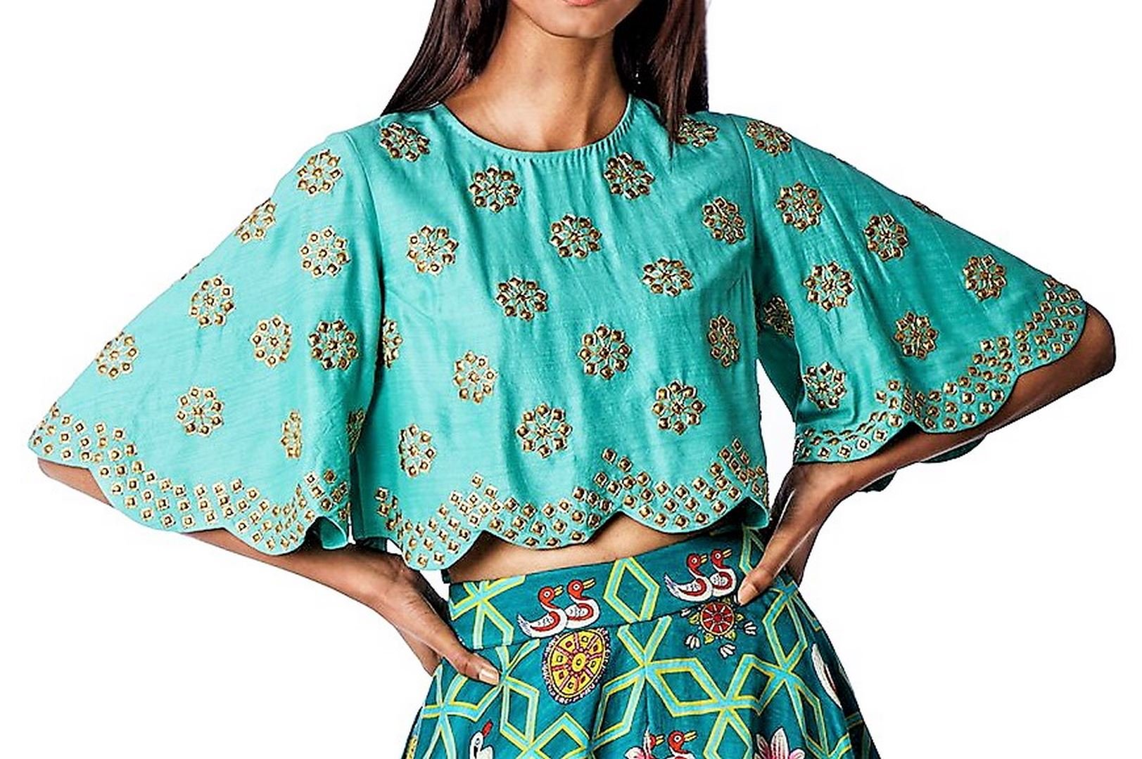 Shop designer dark teal jaal lehenga with danka top online in USA. Find a range of stunning designer dresses by Swati Vijayvargie in USA at Pure Elegance Indian clothing store. Elevate your traditional style with a range of designer silk sarees, Indian clothing, and much more also available at our online store.-top