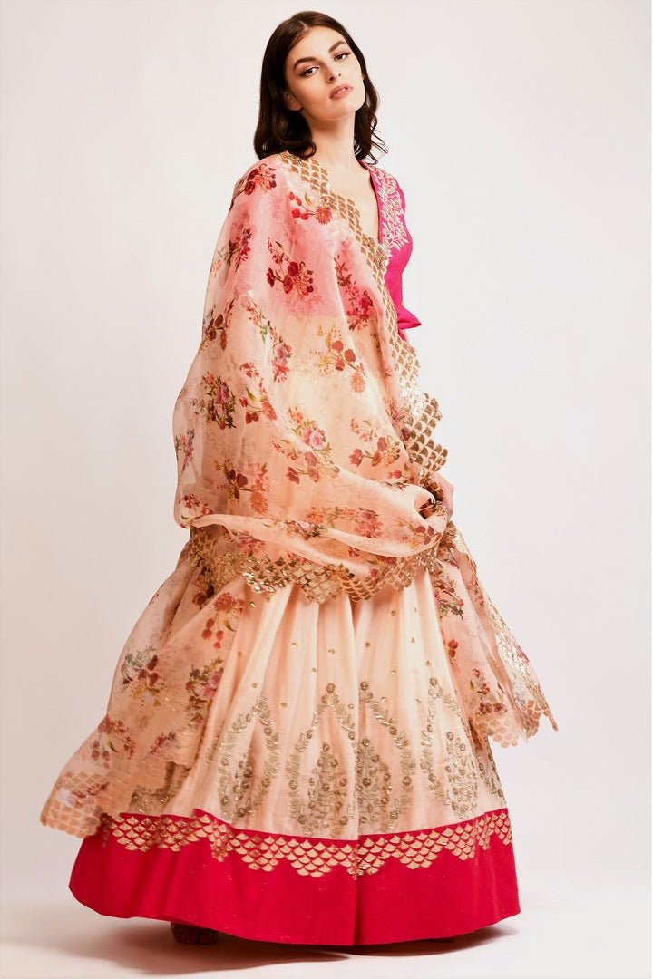 Shop peach embroidered chanderi lehenga with pink raw silk zardozi blouse online in USA and organza dupatta. You can find a fine collection of Indian designer lehengas in USA at Pure Elegance clothing store. Our range of traditional Indian clothing, designer silk saris, wedding sarees, wedding dresses is sure to leave you awestruck. -full view