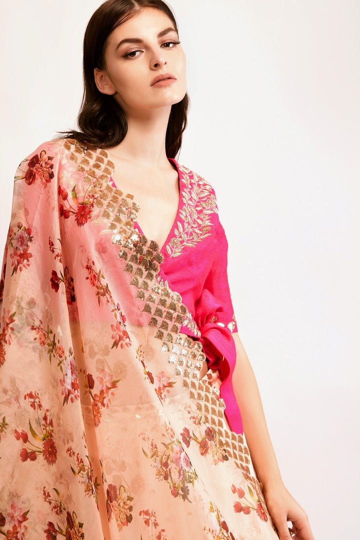 Shop peach embroidered chanderi lehenga with pink raw silk zardozi blouse online in USA and organza dupatta. You can find a fine collection of Indian designer lehengas in USA at Pure Elegance clothing store. Our range of traditional Indian clothing, designer silk saris, wedding sarees, wedding dresses is sure to leave you awestruck. -front