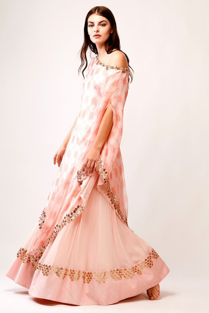 Buy beautiful peach printed organza drop shoulder tunic with georgette skirt online in USA. You can find a fine collection of Indian designer lehengas in USA at Pure Elegance clothing store. Our range of traditional Indian clothing, designer silk saris, wedding sarees, wedding dresses is sure to leave you awestruck. -full view