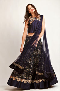 Buy navy blue embroidered lehenga with raw silk crop top online in USA. You can find a fine collection of Indian wedding dresses for bride in USA at Pure Elegance clothing store. Our range of traditional Indian clothing, designer silk saris, wedding sarees,  at our online store is sure to leave you awestruck. -full view
