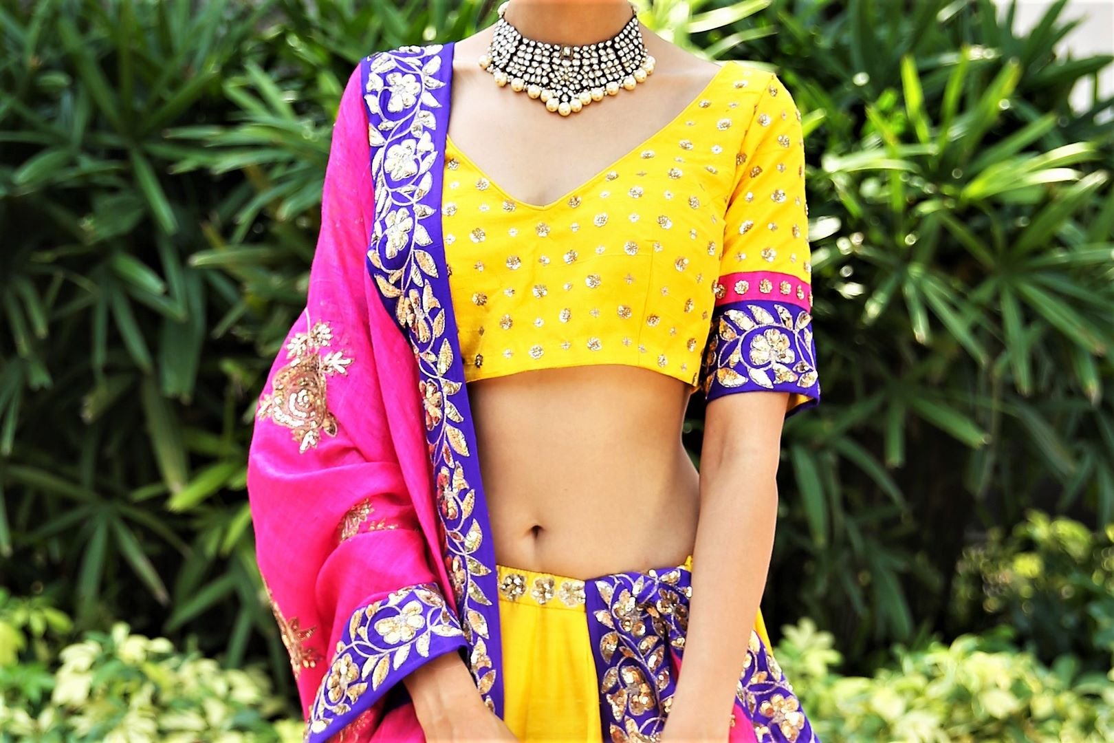 Buy turmeric yellow embroidered dupion lehenga with pink dupatta online in USA. Get wedding ready with a stunning range of Indian designer lehengas from Pure Elegance fashion store in USA. Shop from a collection of silk sarees, wedding sarees, Banarasi sarees, and Indian clothing for a gorgeous ethnic look.-blouse