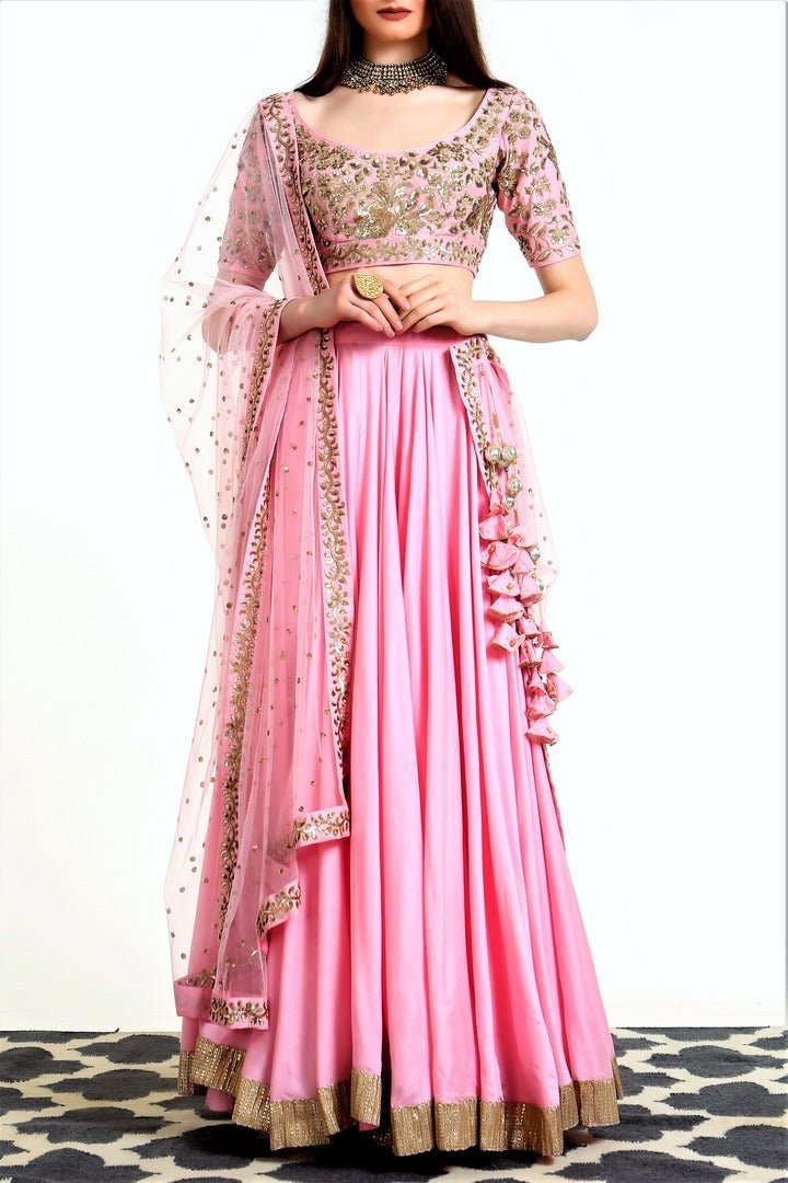 Buy blush pink blended silk lehenga with hand embroidered net dupatta online in USA. Get wedding ready with a stunning range of Indian designer lehengas from Pure Elegance fashion store in USA. Shop from a collection of silk saris, wedding sarees, and Indian clothing for a gorgeous ethnic look from our online store.-full view