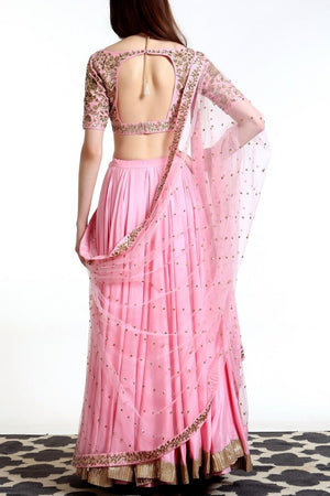 Buy blush pink blended silk lehenga with hand embroidered net dupatta online in USA. Get wedding ready with a stunning range of Indian designer lehengas from Pure Elegance fashion store in USA. Shop from a collection of silk saris, wedding sarees, and Indian clothing for a gorgeous ethnic look from our online store.-back