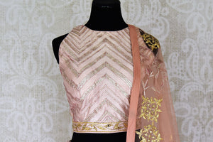 Shop peach color silk applique lehenga with choli & dupatta online in USA. Make your ethnic style absolutely special with a range of designer lehengas, Anarkali suits, Indian clothing available at Pure Elegance Indian fashion store in USA. Find the best Indian dresses for brides in USA also available on our online store.-blouse