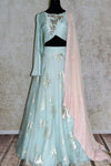 Buy pastel blue organza lehenga with chikankari dupatta online in USA. Make your ethnic style absolutely special with a range of designer lehengas, Anarkali suits, Indian clothing available at Pure Elegance Indian fashion store in USA. Find the best Indian dresses for brides in USA also available on our online store.-full view
