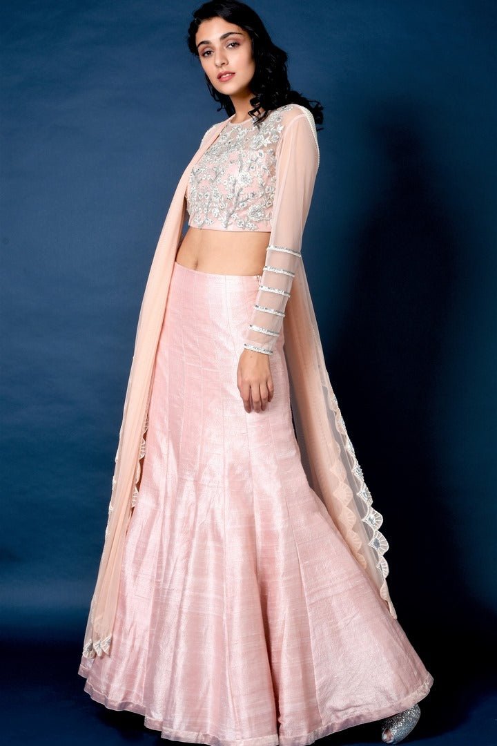 Buy powder pink raw silk lehenga with embroidered blouse online in USA and dupatta. Elevate your ethnic style with a stunning variety of designer dresses from Pure Elegance Indian clothing store in USA, Get your hands on a range of exquisite designer lehengas, wedding sarees, Anarkali suits also available at our online store.-full view
