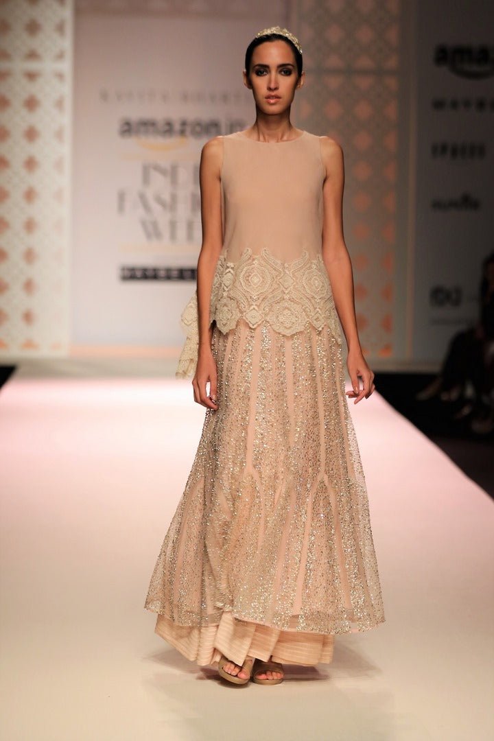 Shop beige color cutwork high low top with skirt online in USA. Make a captivating fashion statement with a range of Indian designer dresses from Pure Elegance clothing store in USA. If you are looking for online shopping, then look to our online store for a stunning collection of designer lehengas, Indian clothing and much more.-front