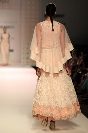 Buy beige color embroidered cape with high low skirt online in USA. Make a captivating fashion statement with a range of Indian designer dresses from Pure Elegance clothing store in USA. If you are looking for online shopping, then look to our online store for a stunning collection of designer lehengas, Indian clothing and much more.-back