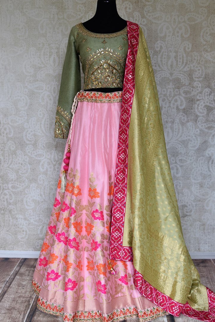 Shop pink and green handwork Banarasi lehenga with dupatta online in USA from Pure Elegance. Be an epitome of Indian fashion in exquisite Indian designer lehengas, embroidered sarees, Anarkali suits available at our exclusive Indian fashion store in USA and also on our online store. Shop now.-full view