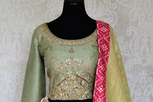 Shop pink and green handwork Banarasi lehenga with dupatta online in USA from Pure Elegance. Be an epitome of Indian fashion in exquisite Indian designer lehengas, embroidered sarees, Anarkali suits available at our exclusive Indian fashion store in USA and also on our online store. Shop now.-front