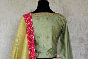 Shop pink and green handwork Banarasi lehenga with dupatta online in USA from Pure Elegance. Be an epitome of Indian fashion in exquisite Indian designer lehengas, embroidered sarees, Anarkali suits available at our exclusive Indian fashion store in USA and also on our online store. Shop now.-back