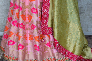 Shop pink and green handwork Banarasi lehenga with dupatta online in USA from Pure Elegance. Be an epitome of Indian fashion in exquisite Indian designer lehengas, embroidered sarees, Anarkali suits available at our exclusive Indian fashion store in USA and also on our online store. Shop now.-bottom