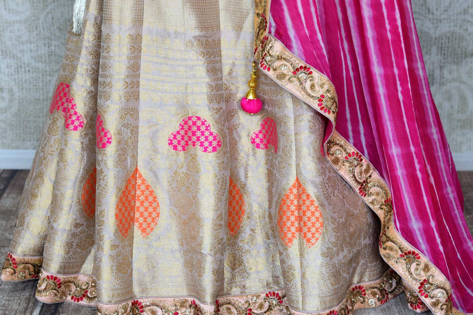 Shop off-white embroidered Banarasi lehenga online in USA with pink dupatta. Get ready to dazzle on weddings and special occasions with an exquisite variety of Indian designer clothes from Pure Elegance Indian clothing store in USA. We have a splendid collection of bridal lehengas, designer sarees, Anarkali suits to make your look absolutely one of kind.-bottom