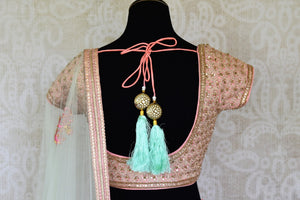 Buy beautiful blush pink embroidered chanderi silk lehenga online in USA with dupatta. Get ready to dazzle on weddings and special occasions with an exquisite variety of Indian designer clothes from Pure Elegance Indian clothing store in USA. We have a splendid collection of bridal lehengas, designer sarees, Anarkali suits to make your look absolutely one of kind.-back