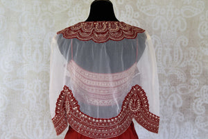 Buy red and white contemporary style silk skirt and crop top online in USA from Pure Elegance. Make every occasion special with stunning Indian designer clothing, Anarkali suits, wedding dresses, designer gowns from our Indian clothing store in USA. -back