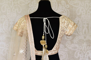 Shop gold embroidered net silk lehenga online in USA with dupatta. Get ready to dazzle on weddings and special occasions with an exquisite variety of Indian designer clothes from Pure Elegance Indian clothing store in USA. We have a splendid collection of bridal lehengas, designer sarees, Anarkali suits to make your look absolutely one of kind.-back