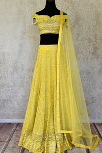 Buy lemon yellow embroidered georgette lehenga with dupatta online in USA. Shop more such Indian designer lehengas, designer Indian dresses, wedding dresses in USA from Pure Elegance clothing fashion store this wedding season.-full view