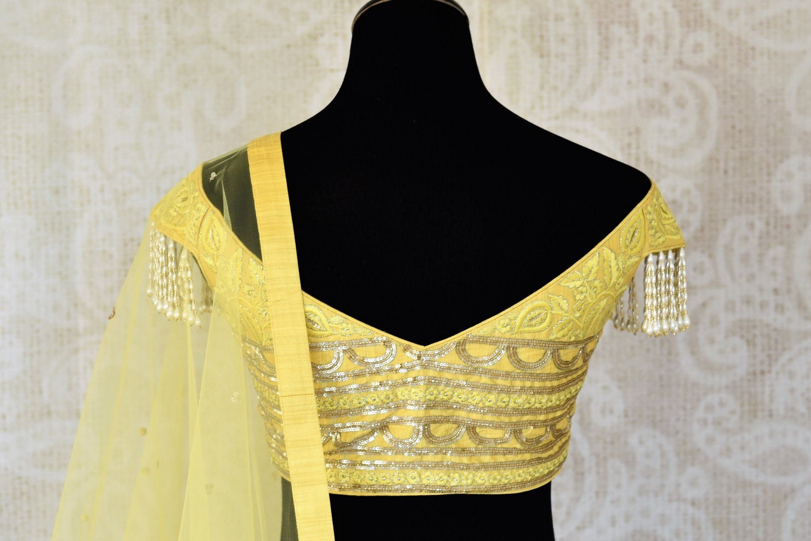 Buy lemon yellow embroidered georgette lehenga with dupatta online in USA. Shop more such Indian designer lehengas, designer Indian dresses, wedding dresses in USA from Pure Elegance clothing fashion store this wedding season.-back