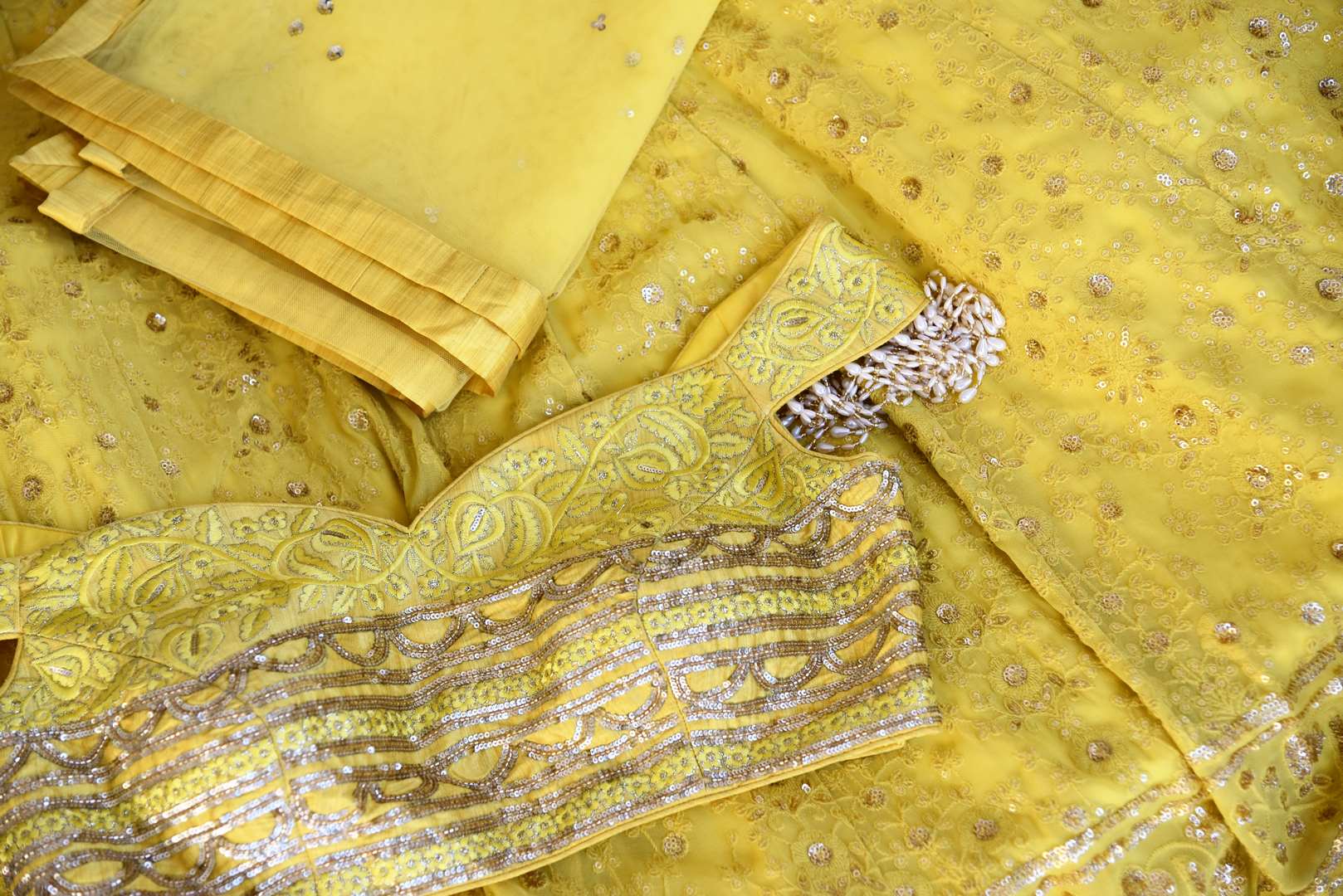 Buy lemon yellow embroidered georgette lehenga with dupatta online in USA. Shop more such Indian designer lehengas, designer Indian dresses, wedding dresses in USA from Pure Elegance clothing fashion store this wedding season.-details
