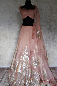 Shop blush pink designer tissue applique work lehenga online in USA. Make your style extraordinary on weddings and special occasions with Indian designer lehenga, traditional dresses, Anarkali suits from Pure Elegance Indian clothing store in USA.-full view