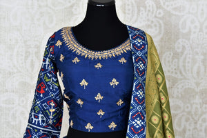 Buy dark blue patola print gota work silk lehenga online in USA with green dupatta. Be the talk of weddings and special occasions with a splendid collection of Indian designer lehengas from Pure Elegance Indian clothing store in USA. We have a spectacular range of bridal lehengas for Indian brides in USA. -front