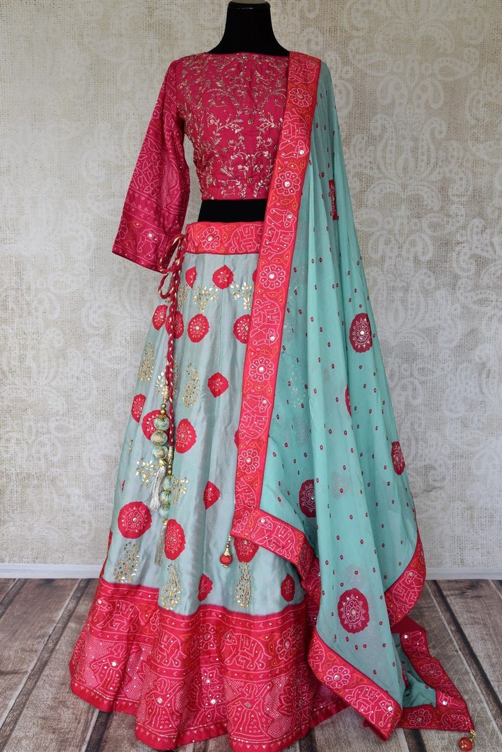 Shop sky blue and pink embroidered silk bandhej lehenga online in USA with dupatta. Be the talk of weddings and special occasions with a splendid collection of Indian designer lehengas from Pure Elegance Indian clothing store in USA. We have a spectacular range of bridal lehengas for Indian brides in USA. -full view