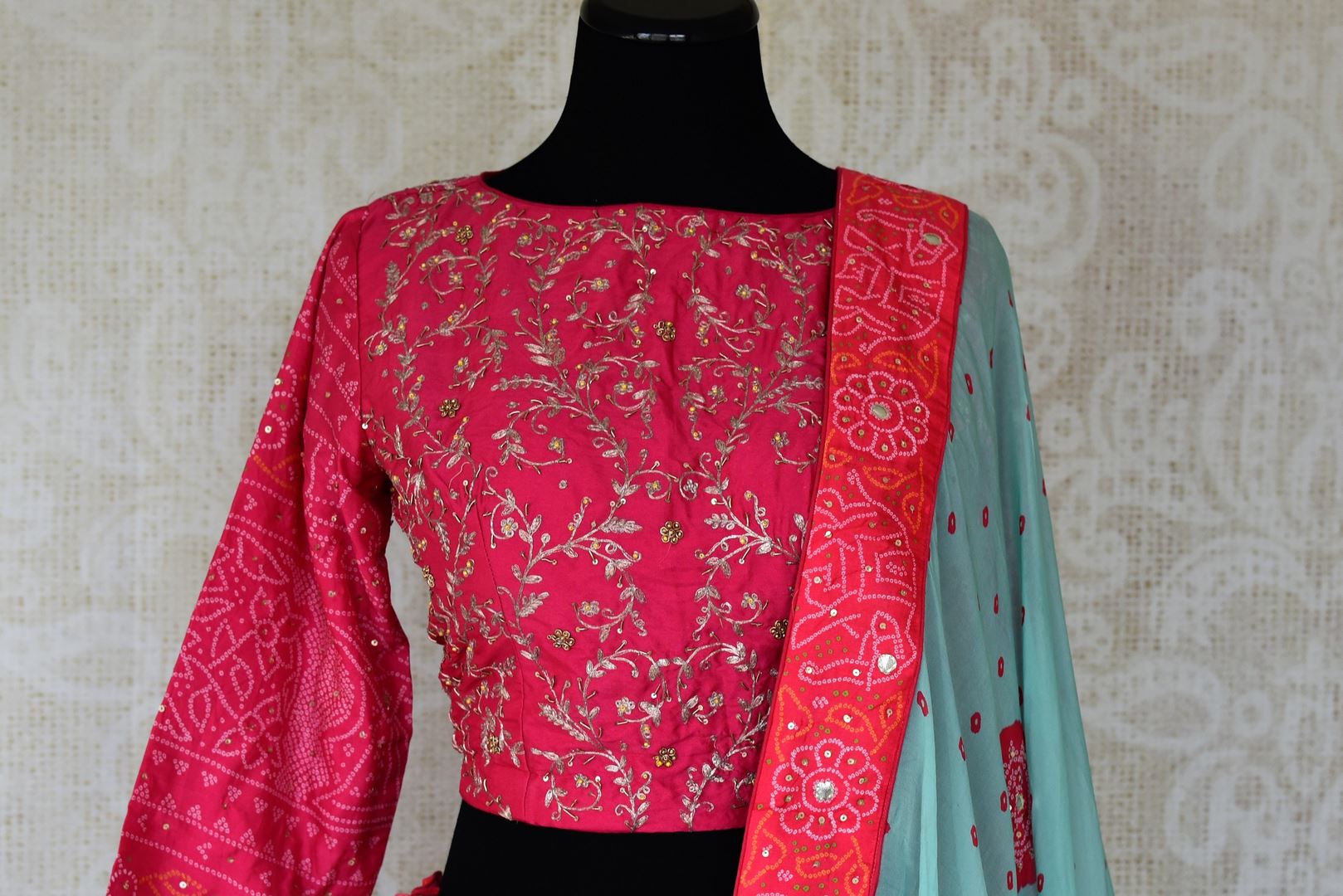 Shop sky blue and pink embroidered silk bandhej lehenga online in USA with dupatta. Be the talk of weddings and special occasions with a splendid collection of Indian designer lehengas from Pure Elegance Indian clothing store in USA. We have a spectacular range of bridal lehengas for Indian brides in USA. -front