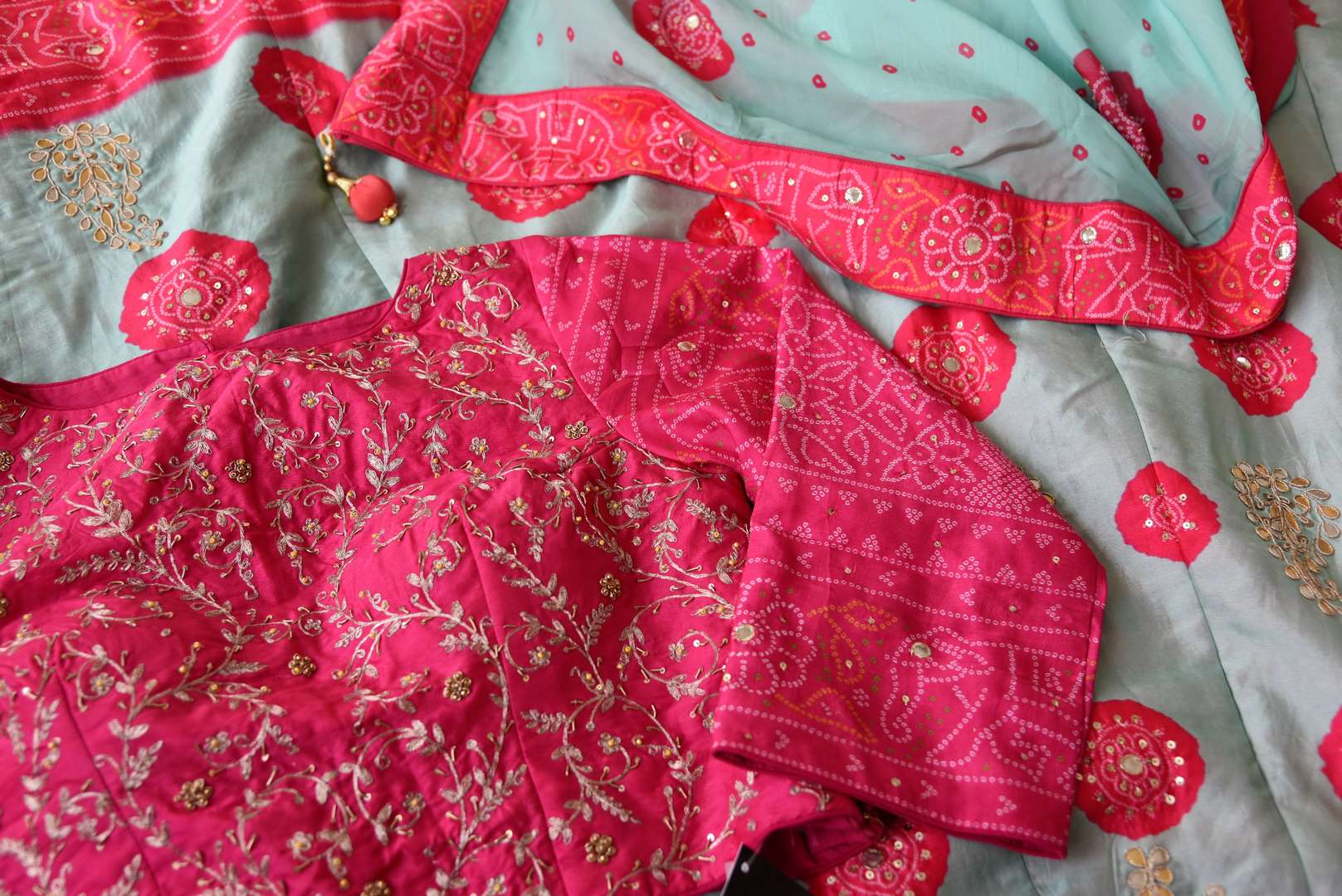 Shop sky blue and pink embroidered silk bandhej lehenga online in USA with dupatta. Be the talk of weddings and special occasions with a splendid collection of Indian designer lehengas from Pure Elegance Indian clothing store in USA. We have a spectacular range of bridal lehengas for Indian brides in USA. -details