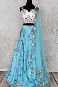 Buy blue and white floral embroidered designer lehenga online in USA with dupatta. Pick your favorite Indian clothing from a colorful collection available at Pure Elegance Indian fashion store in USA. We have an alluring range of wedding lehengas, designer Anarkali suits, gowns for Indian women in USA.-full view
