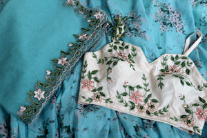 Buy blue and white floral embroidered designer lehenga online in USA with dupatta. Pick your favorite Indian clothing from a colorful collection available at Pure Elegance Indian fashion store in USA. We have an alluring range of wedding lehengas, designer Anarkali suits, gowns for Indian women in USA.-details