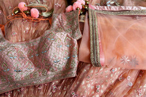Buy peach net and silk embroidered lehenga online in USA with dupatta. Pick your favorite Indian clothing from a colorful collection available at Pure Elegance Indian fashion store in USA. We have an alluring range of wedding lehengas, designer Anarkali suits, gowns for Indian women in USA.-details