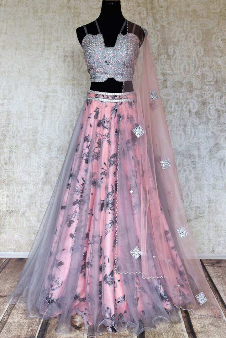 Shop pink and grey floral embroidered silk lehenga online in USA with net overlay and dupatta. Keep your wardrobe update with latest Indian designer clothese from Pure Elegance Indian fashion store in USA. Shop traditional Anarkali suits, designer lehengas for Indian brides in USA from our online store.-full view