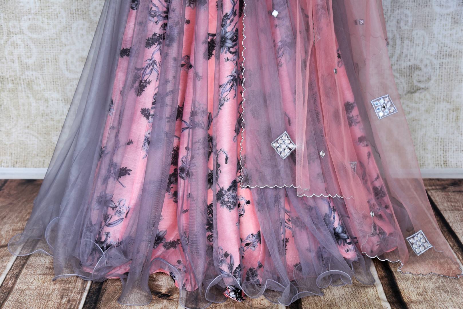 Shop pink and grey floral embroidered silk lehenga online in USA with net overlay and dupatta. Keep your wardrobe update with latest Indian designer clothese from Pure Elegance Indian fashion store in USA. Shop traditional Anarkali suits, designer lehengas for Indian brides in USA from our online store.-bottom