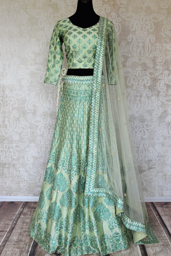 Buy pastel green printed silk lehenga online in USA with hand embroidery. Make fashionable choices with latest Indian designer clothing from Pure Elegance Indian fashion store in USA. Shop Indian salwar suits, designer Anarkali suits and bridal lehengas for Indian brides in USA from our online store.-full view
