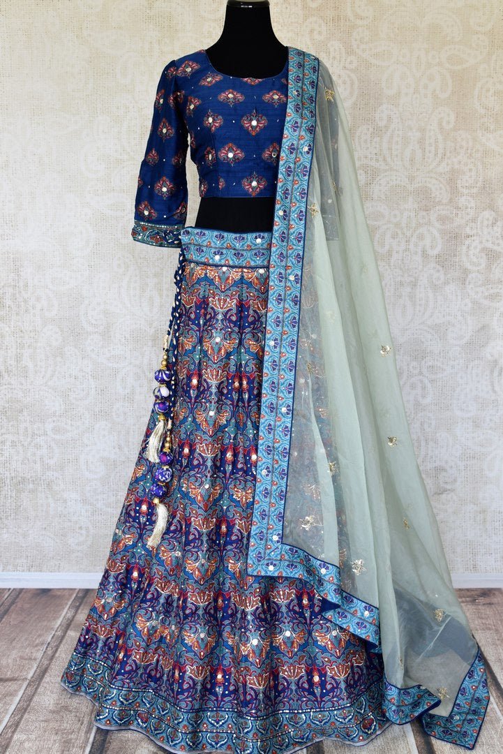Shop blue printed silk lehenga online in USA with hand embroidery. Make fashionable choices with latest Indian designer clothing from Pure Elegance Indian fashion store in USA. Shop Indian salwar suits, designer Anarkali suits and bridal lehengas for Indian brides in USA from our online store.-full view
