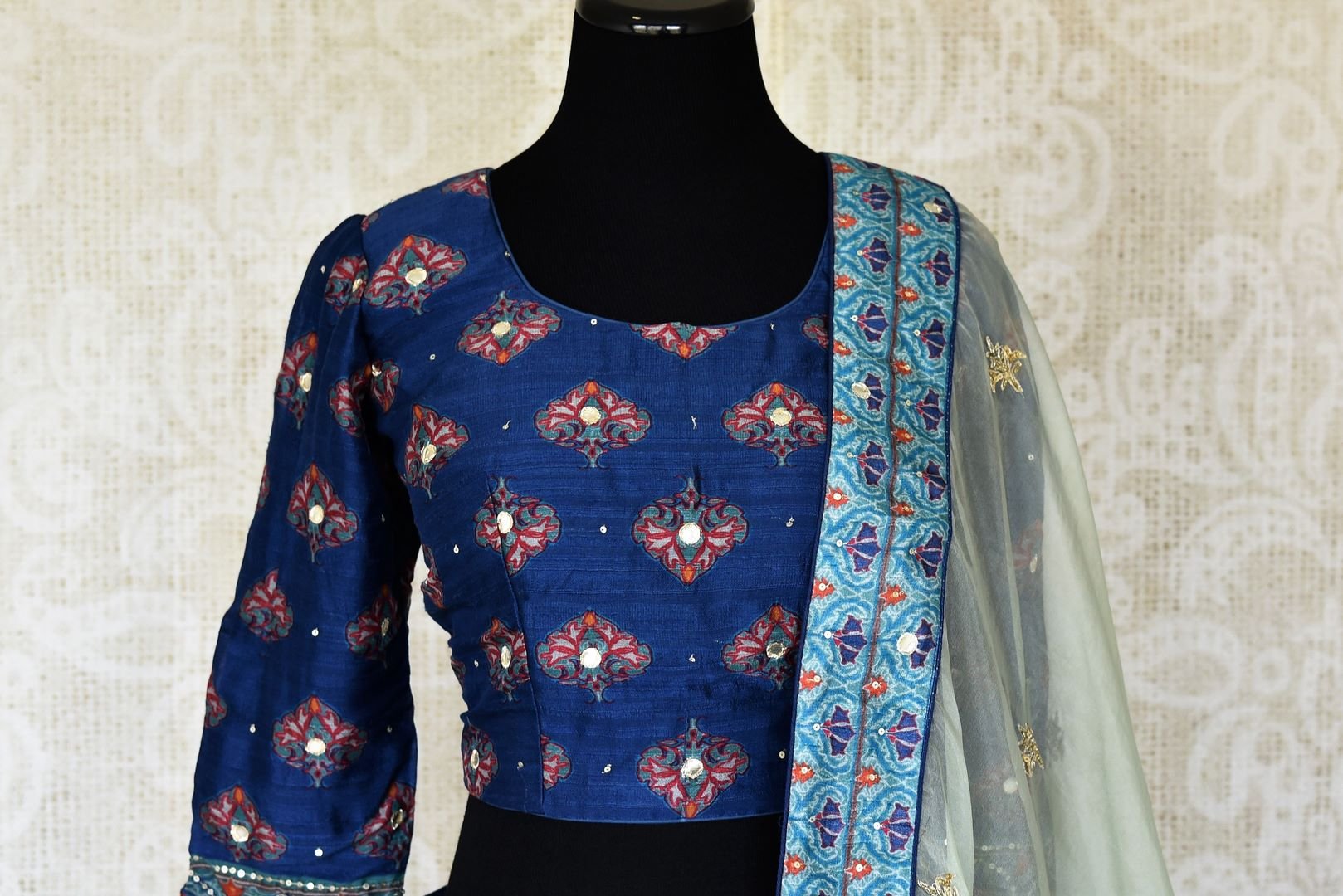 Shop blue printed silk lehenga online in USA with hand embroidery. Make fashionable choices with latest Indian designer clothing from Pure Elegance Indian fashion store in USA. Shop Indian salwar suits, designer Anarkali suits and bridal lehengas for Indian brides in USA from our online store.-front